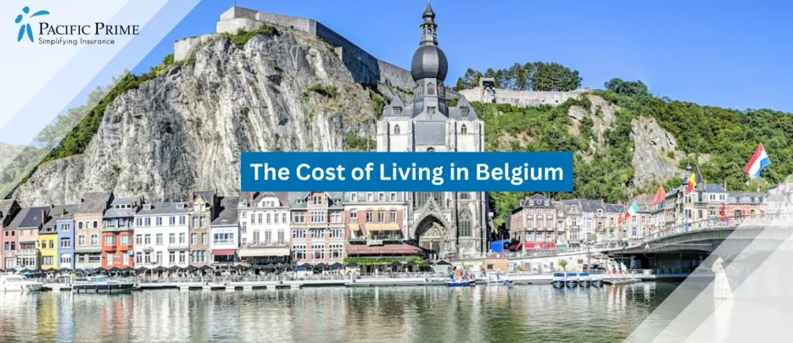 Image of Grey Buildings Along Calm River In Dinant, Belgium with text overlay of "The Cost of Living in Belgium"