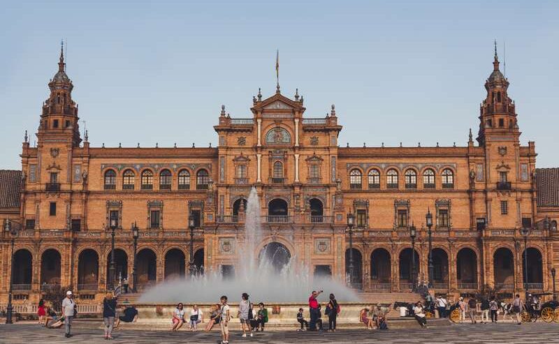 Seville's Spain Square: Town Hall And Fountain Under Blue Sky