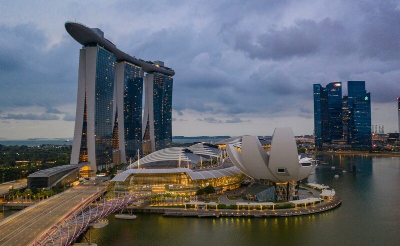 Ship Docked Near Singapore City Buildings In Daylight