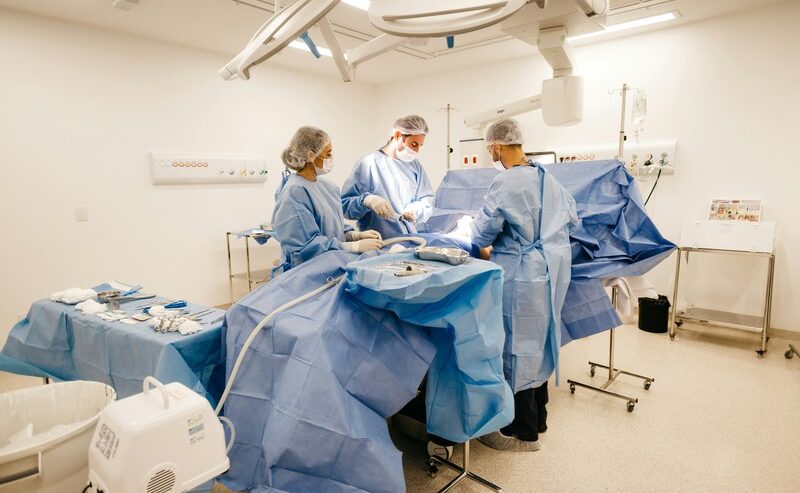 Three Doctors During A Cesarean Birth Procedure